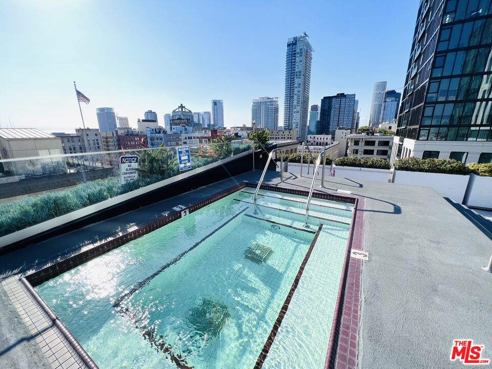 756 South Spring Street, Unit 404 Los Angeles, CA 90014 - Photo 9 of 14 a view of swimming pool from a balcony