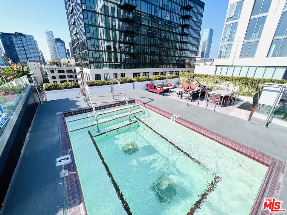 756 South Spring Street, Unit 404 Los Angeles, CA 90014 - Photo 10 of 14 a view of swimming pool with outdoor seating