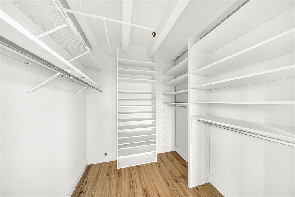 1731 Beacon Street, Unit 1515 Brookline, MA 02445 - Photo 26 of 40 a view of walk in closet with empty racks