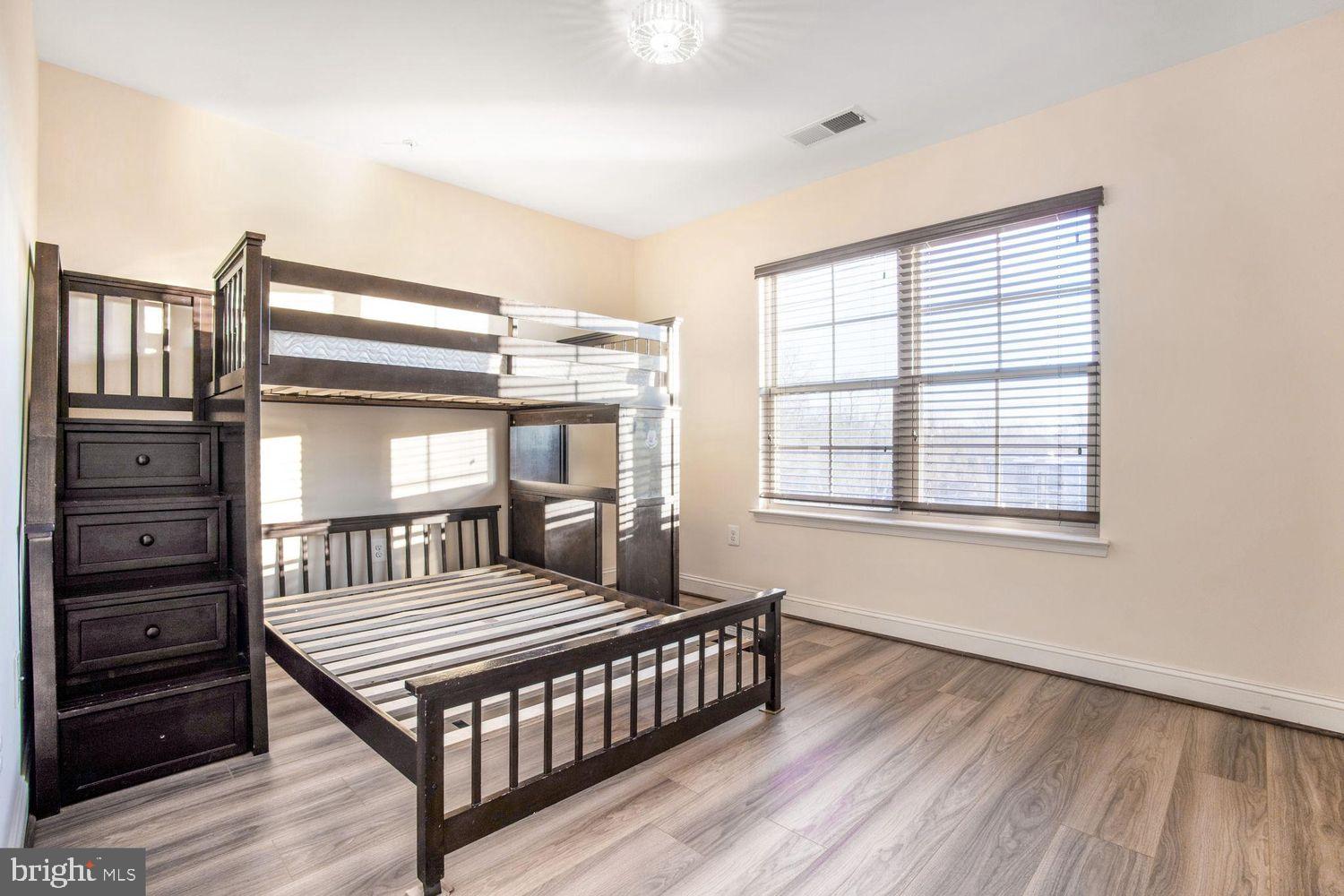 3041 Bel Pre Road Silver Spring, MD 20906 - Photo 21 of 30 a bedroom with a bed next to a window