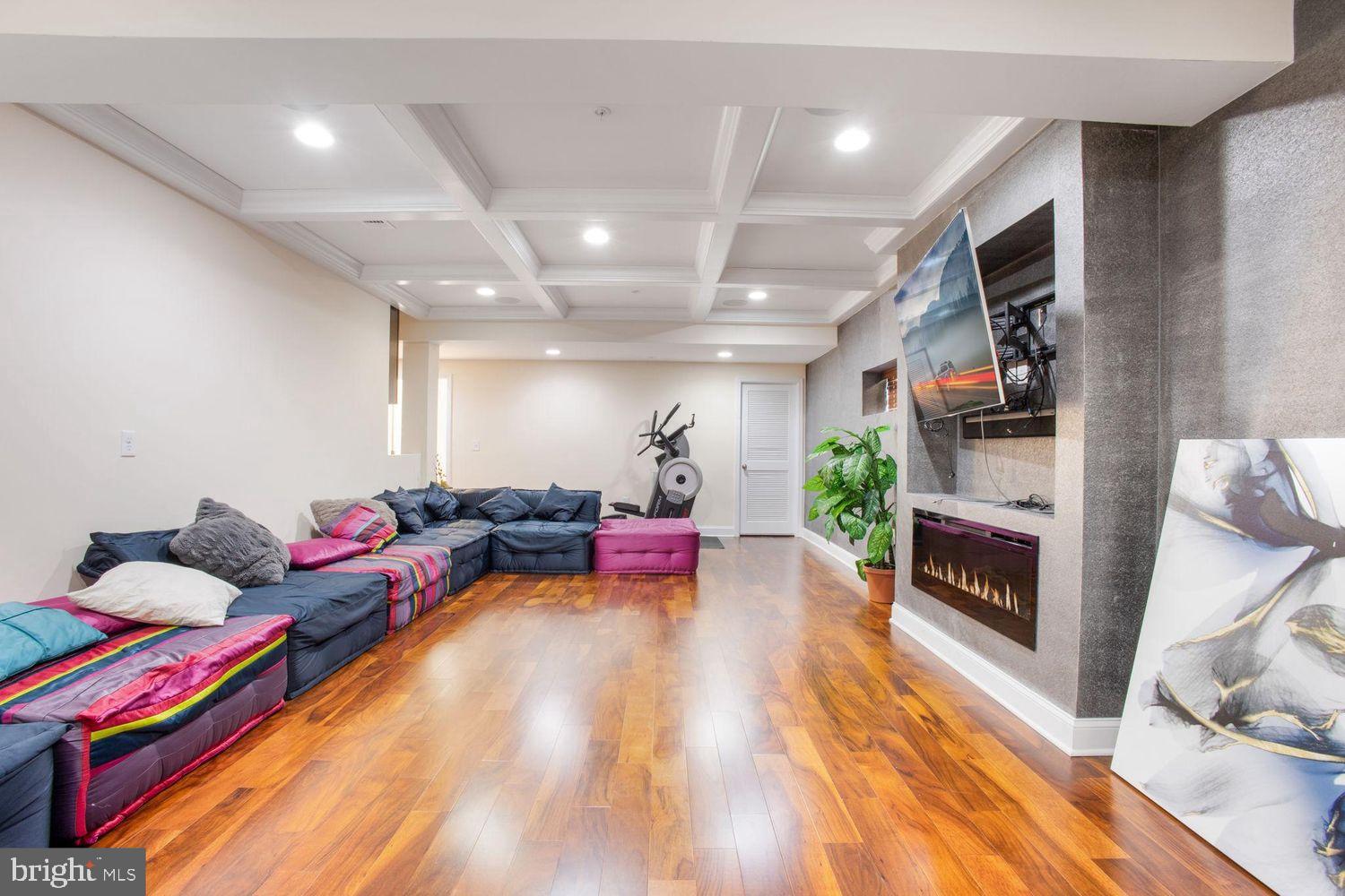 3041 Bel Pre Road Silver Spring, MD 20906 - Photo 26 of 30 a living room with furniture fireplace and flat screen tv