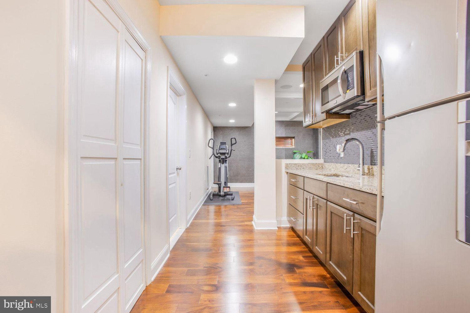 3041 Bel Pre Road Silver Spring, MD 20906 - Photo 28 of 30 a kitchen with stainless steel appliances granite countertop a refrigerator and a sink