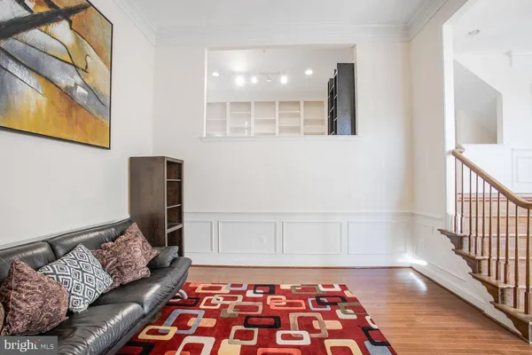 a living room with a couch and a rug