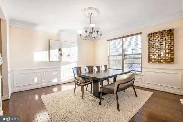 a view of a dining room with furniture and window