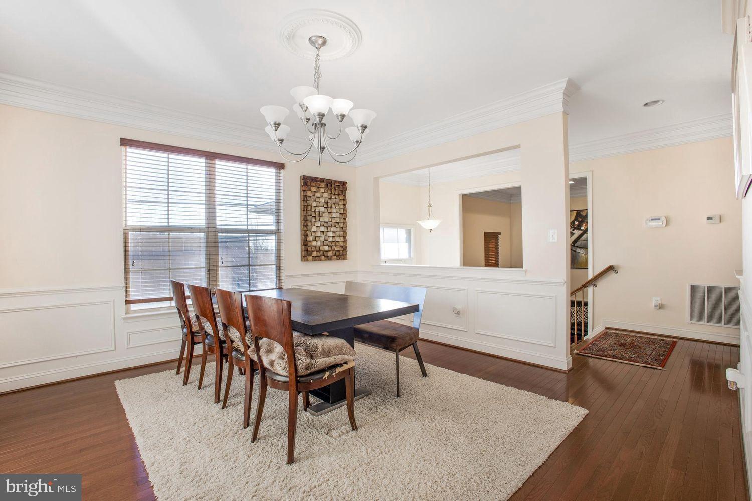 3041 Bel Pre Road Silver Spring, MD 20906 - Photo 9 of 30 a view of a dining room with furniture window and wooden floor