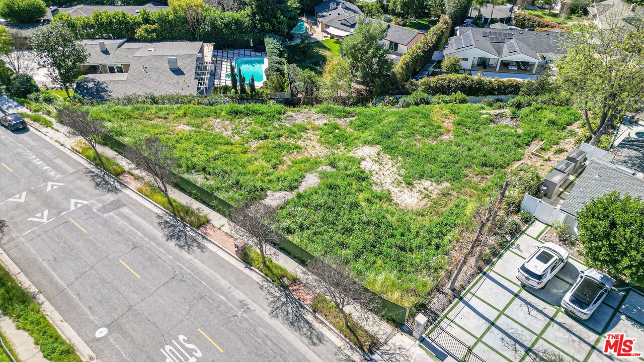 an aerial view of residential house with outdoor space