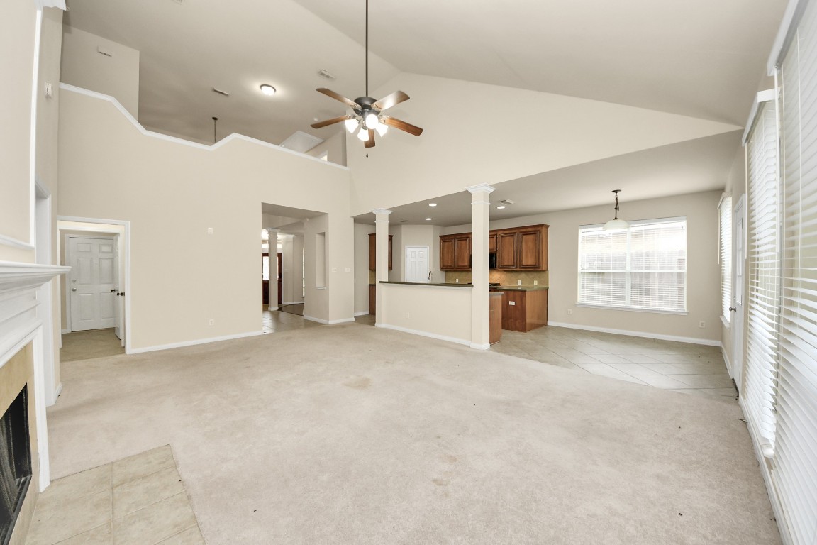 28306 Peper Hollow Lane Spring, TX 77386 - Photo 12 of 39 an empty room with chandelier fan and windows