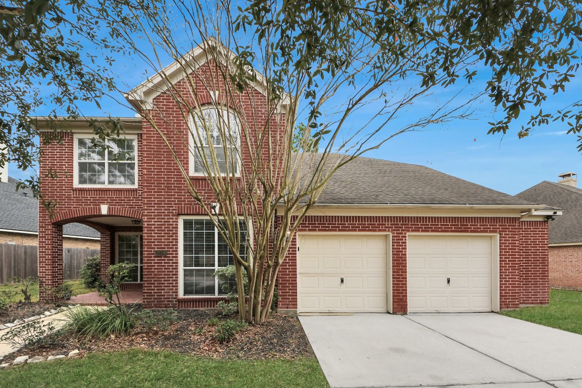 28306 Peper Hollow Lane Spring, TX 77386 - Photo 2 of 39 front view of a house with a garden