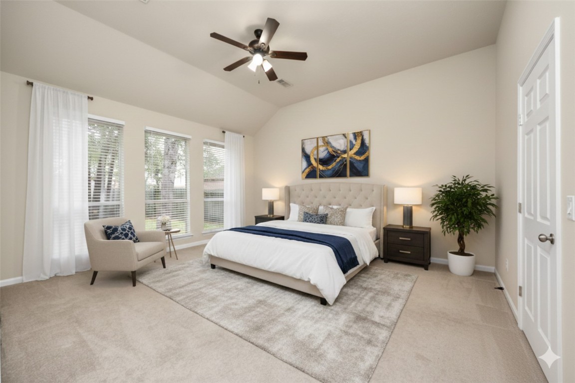 28306 Peper Hollow Lane Spring, TX 77386 - Photo 21 of 39 a spacious bedroom with a bed a couch and a window