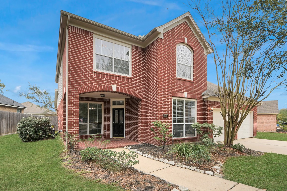 28306 Peper Hollow Lane Spring, TX 77386 - Photo 3 of 39 a front view of a house with garden