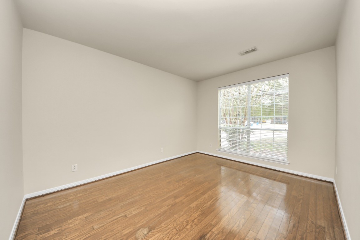 28306 Peper Hollow Lane Spring, TX 77386 - Photo 8 of 39 an empty room with wooden floor and windows