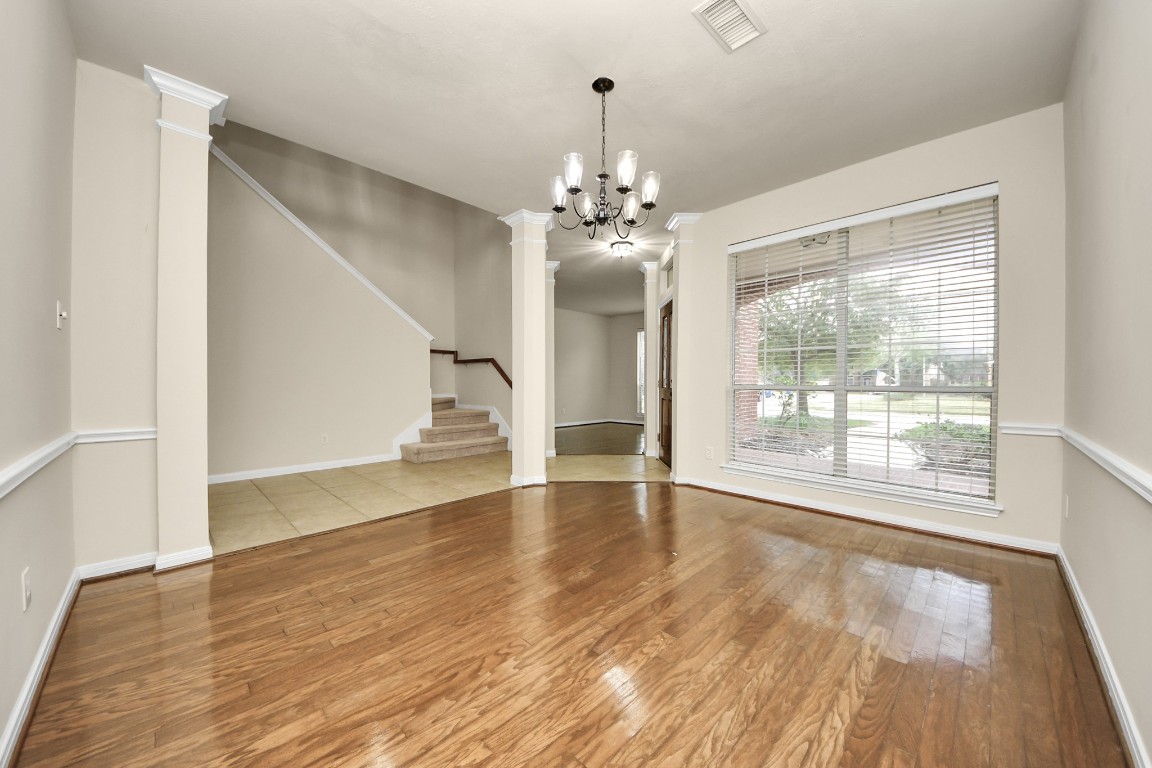 28306 Peper Hollow Lane Spring, TX 77386 - Photo 9 of 39 a view of an empty room with wooden floor and a window