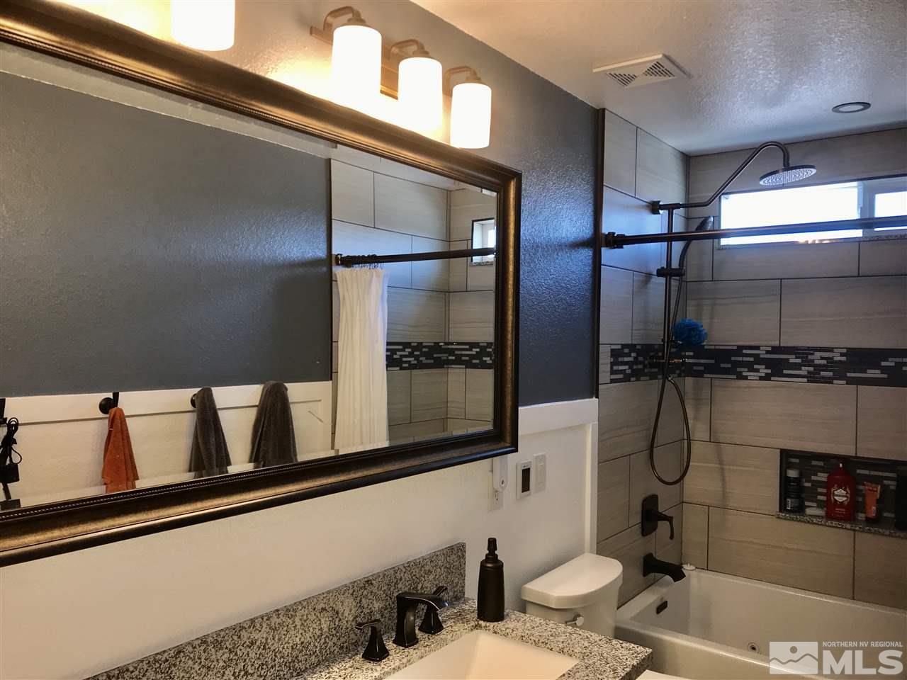 11610 Cervino Drive Reno, NV 89521 - Photo 14 of 20 a bathroom with a sink and a mirror