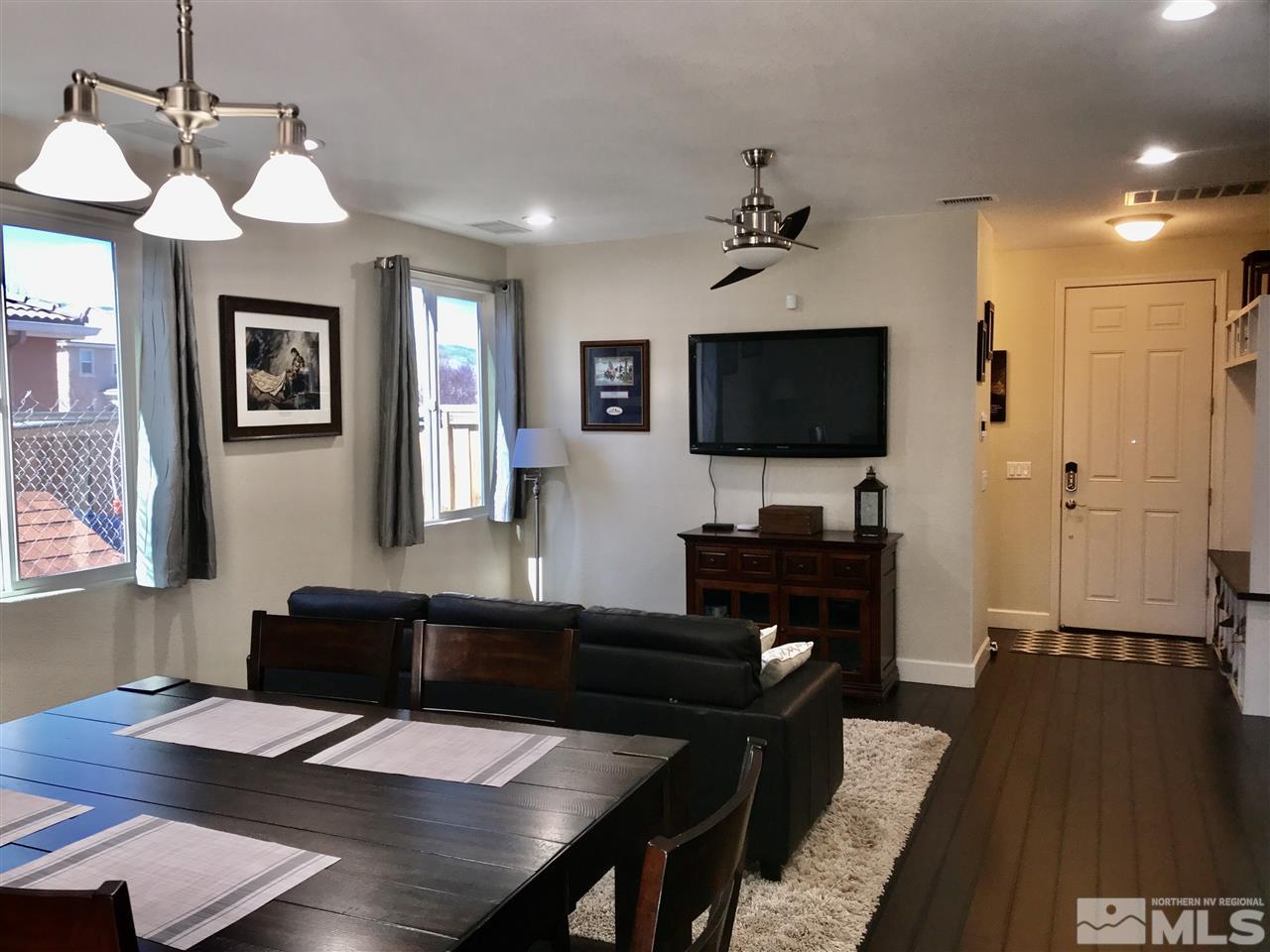 11610 Cervino Drive Reno, NV 89521 - Photo 4 of 20 a living room with furniture a flat screen tv and kitchen view