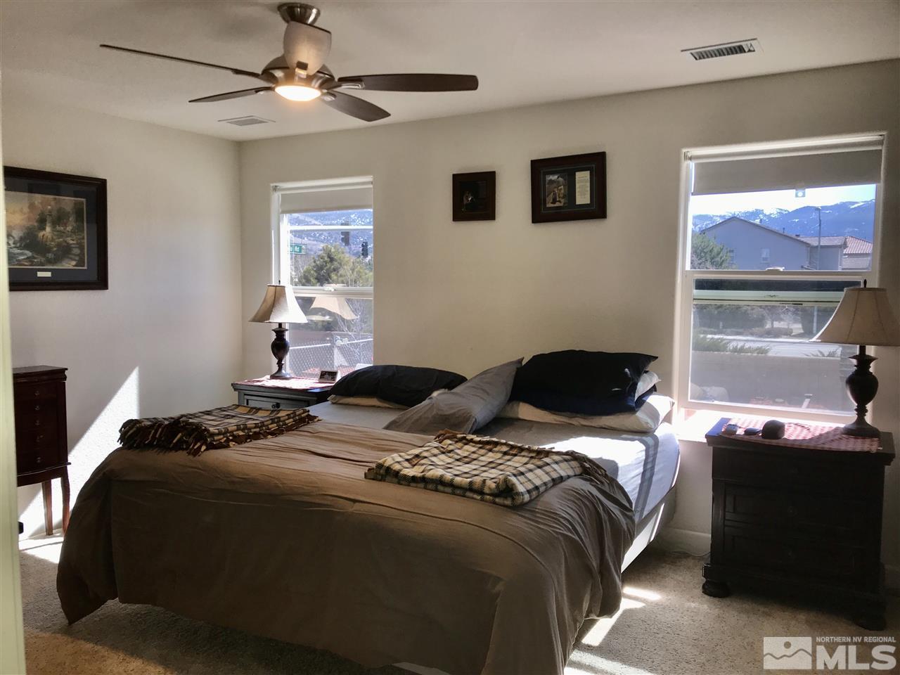 11610 Cervino Drive Reno, NV 89521 - Photo 9 of 20 a bedroom with a bed and a window