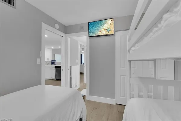 a bedroom with a bed and a cabinets