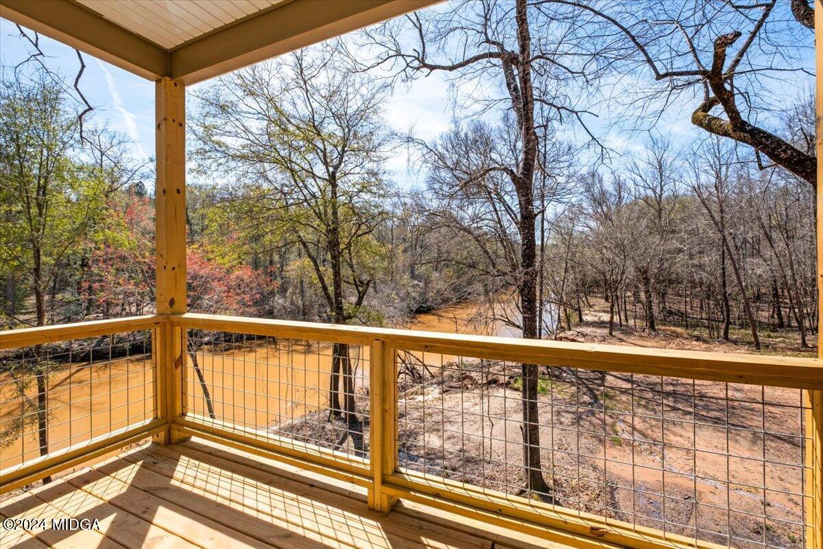 138 Towaliga Road Forsyth, GA 31029 - Photo 20 of 25 a view of a balcony with trees