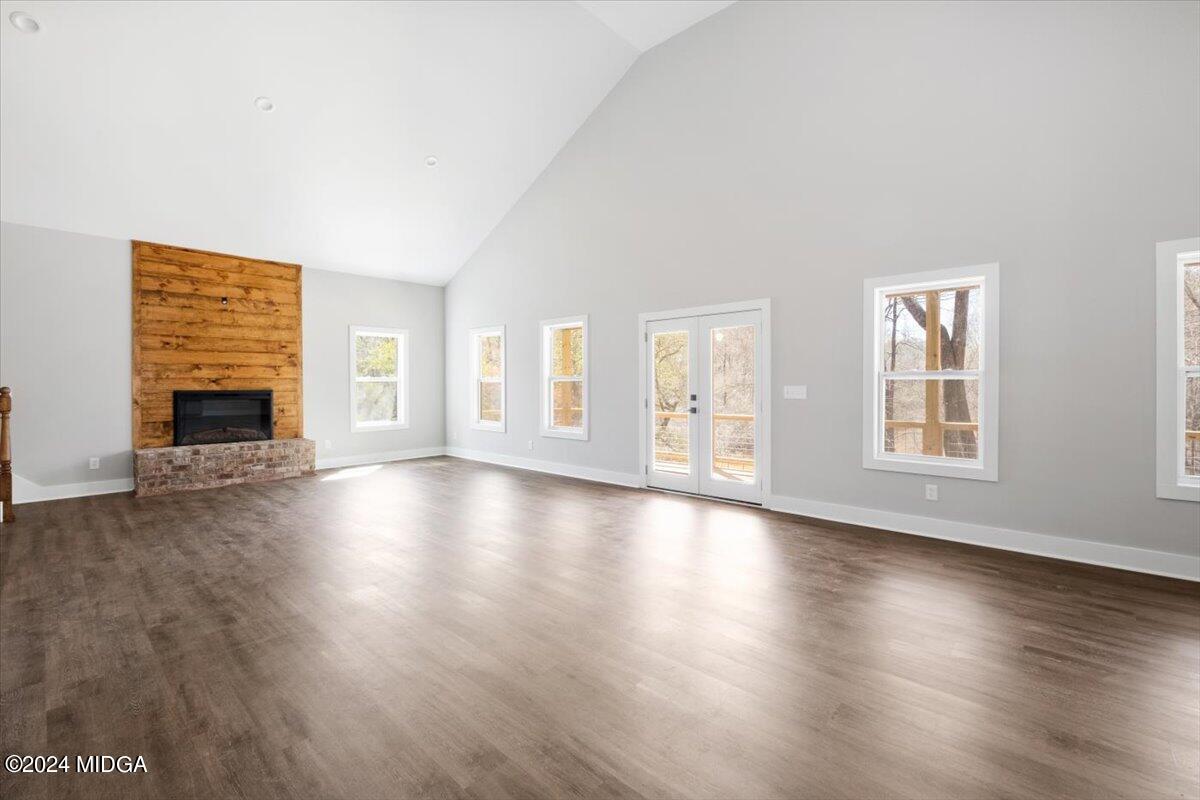 138 Towaliga Road Forsyth, GA 31029 - Photo 3 of 25 a view of an empty room with window and wooden floor