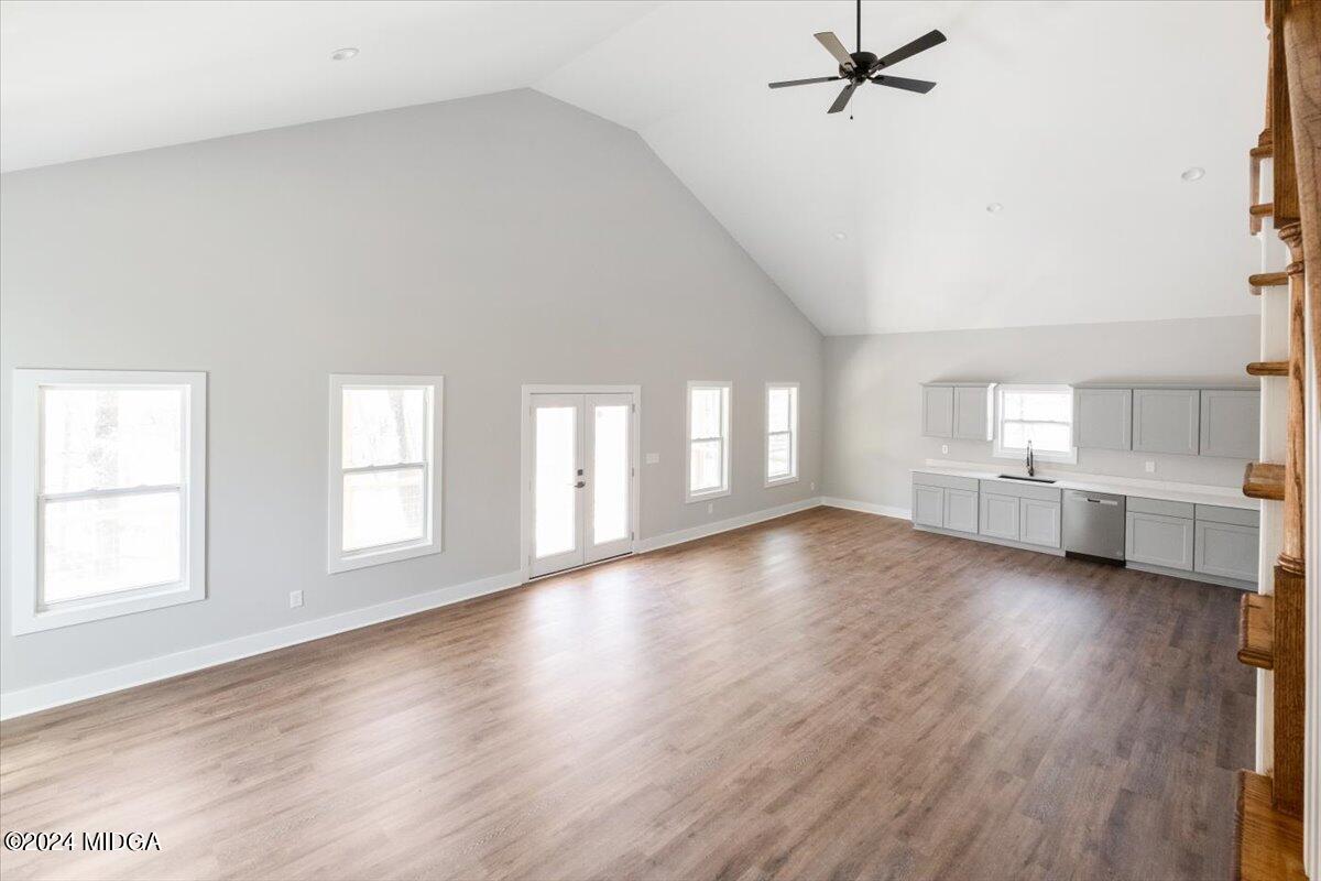 138 Towaliga Road Forsyth, GA 31029 - Photo 7 of 25 an empty room with wooden floor and windows