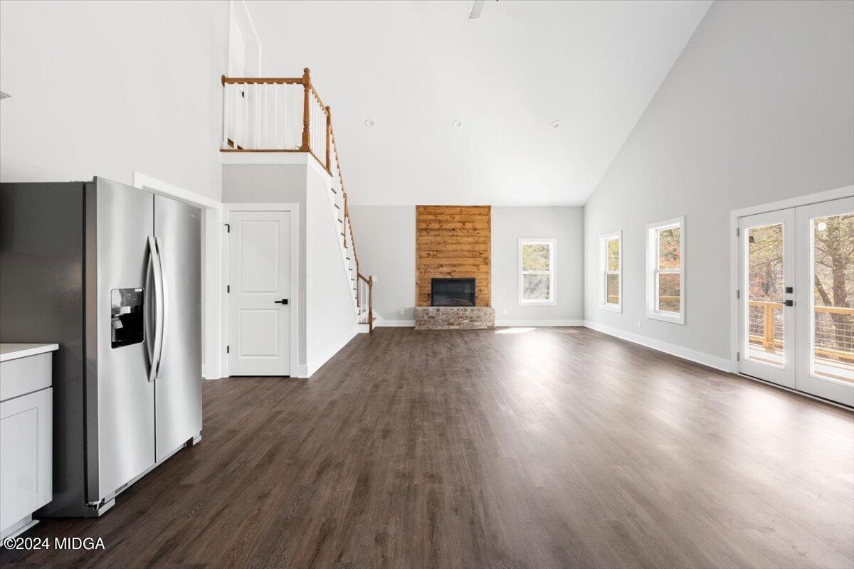 138 Towaliga Road Forsyth, GA 31029 - Photo 8 of 25 a view of an empty room with wooden floor and a window