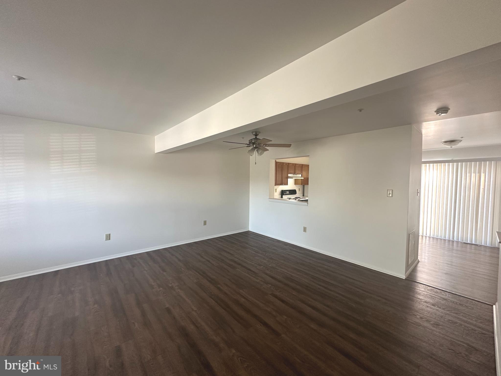 108 Jason's Ridge Smithsburg, MD 21783 - Photo 4 of 32 an empty room with wooden floor and windows