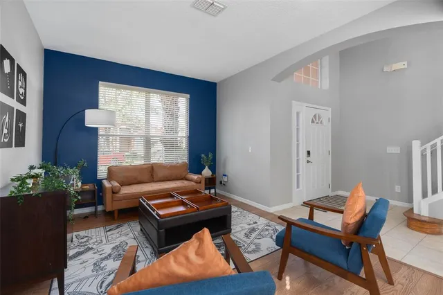 a living room with furniture and a large window