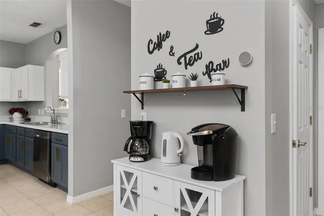 a kitchen with a sink stainless steel appliances and cabinets