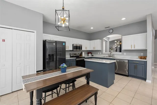 a kitchen with a sink cabinets and window
