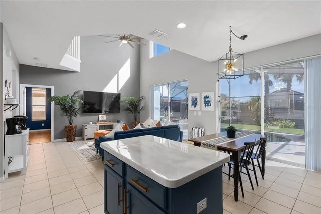 a bedroom with a bed a window and a flat screen television