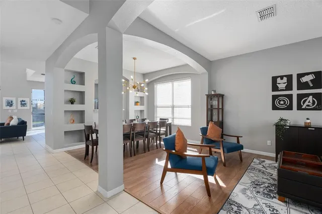 a living room with furniture and a window