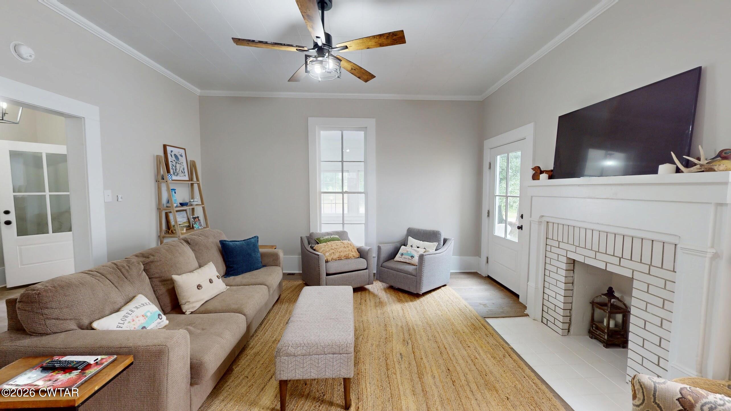 2800 Locust Grove Road Newbern, TN 38059 - Photo 9 of 46 a living room with furniture and a flat screen tv