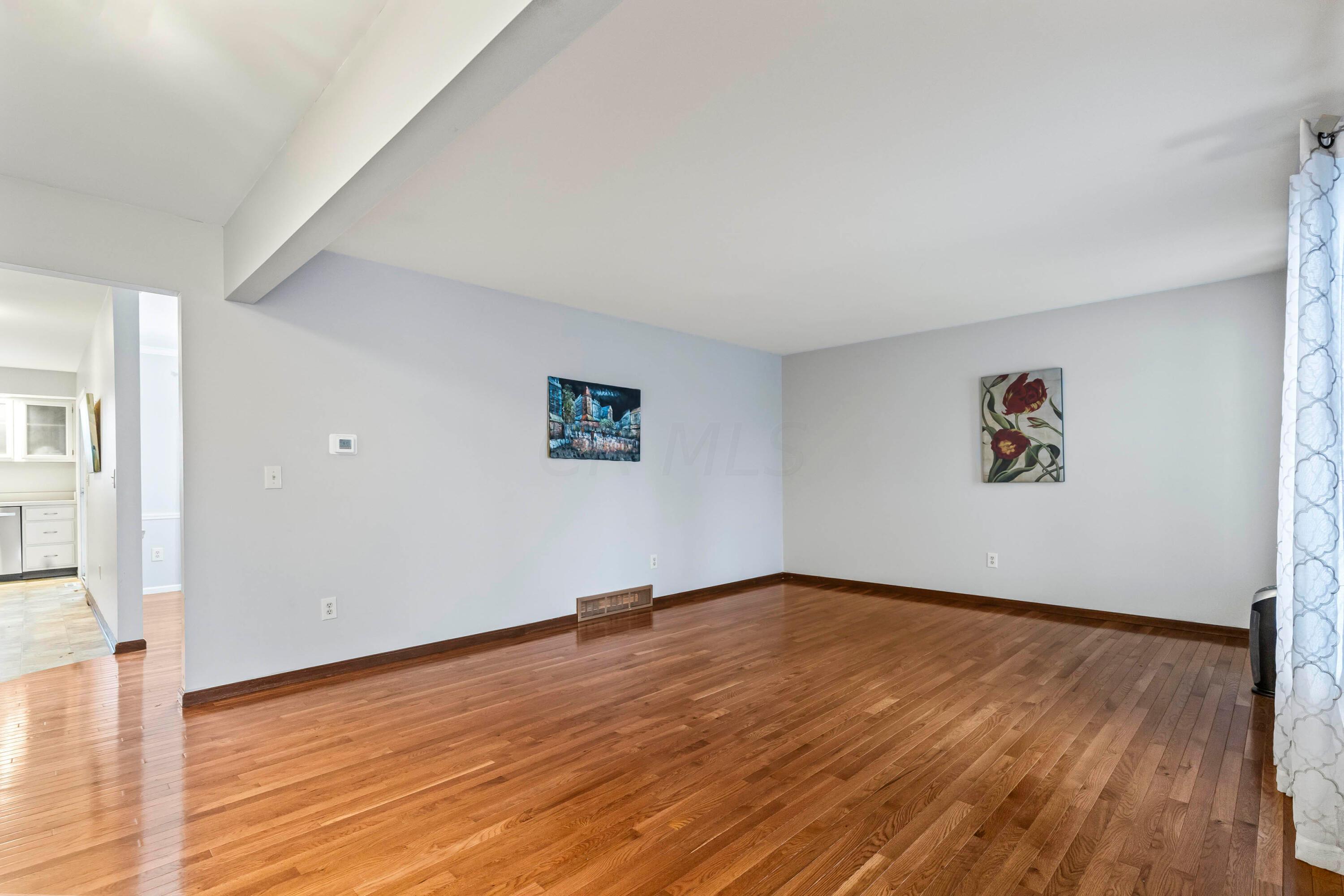 7020 Rieber Street Columbus, OH 43085 - Photo 7 of 40 • New hardwood flooring ~ 2012 • Grey painted walls • Drapes are negotiable