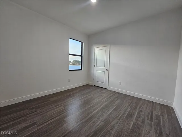 a view of a utility room with wooden floor
