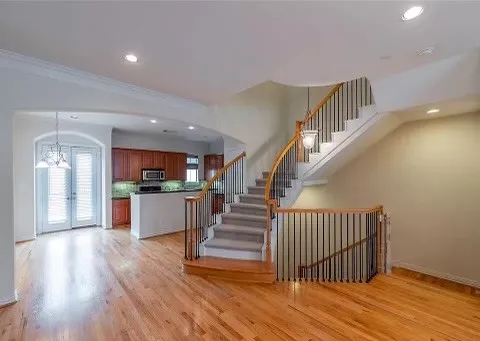 a view of kitchen and hall with wooden floor