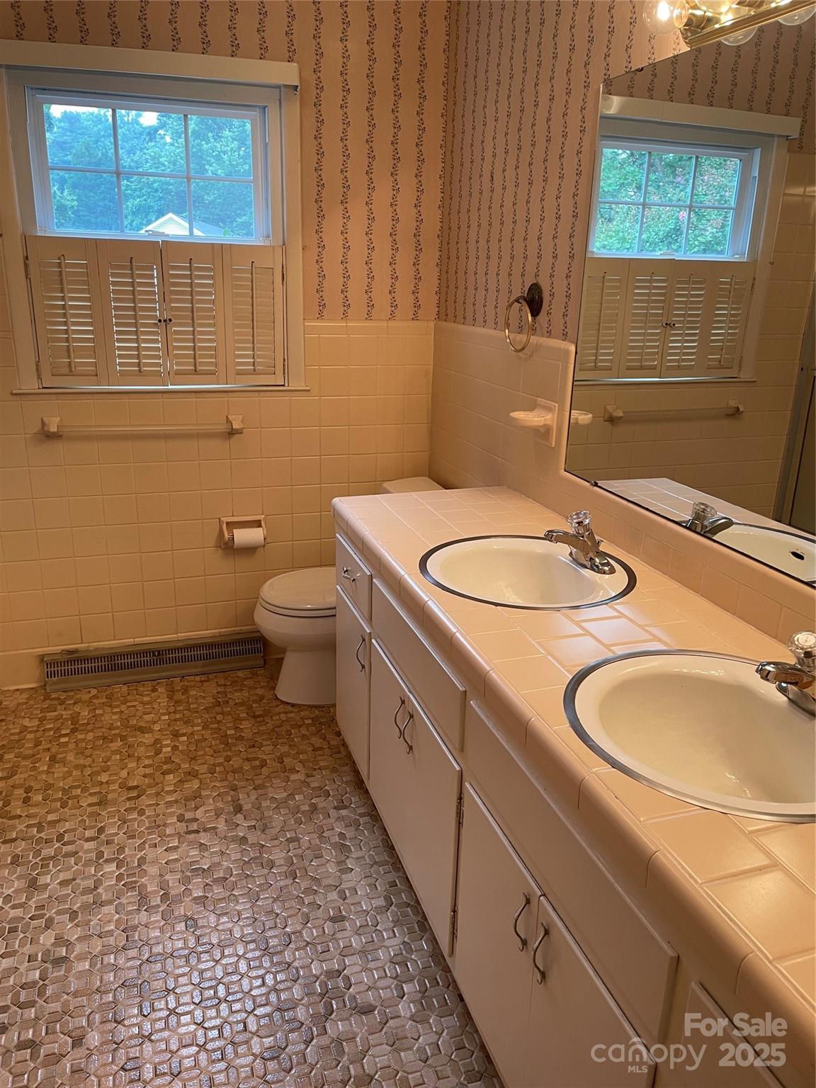 135 Devon Drive Salisbury, NC 28147 - Photo 14 of 16 a bathroom with a granite countertop toilet and sink