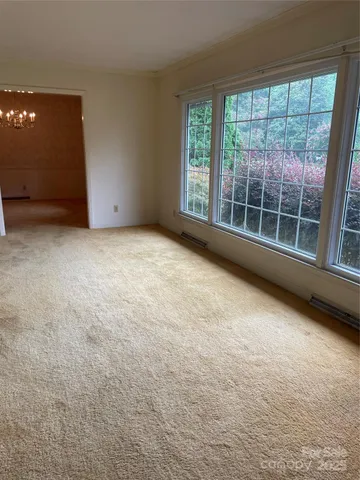 a view of an empty room with a window