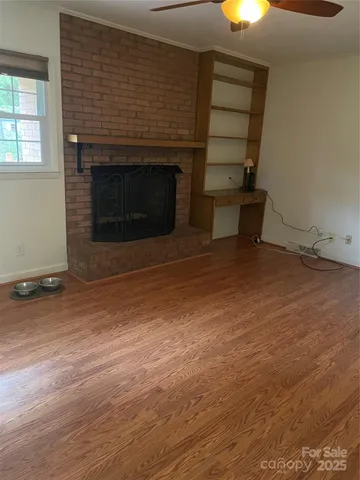 an empty room with a fireplace