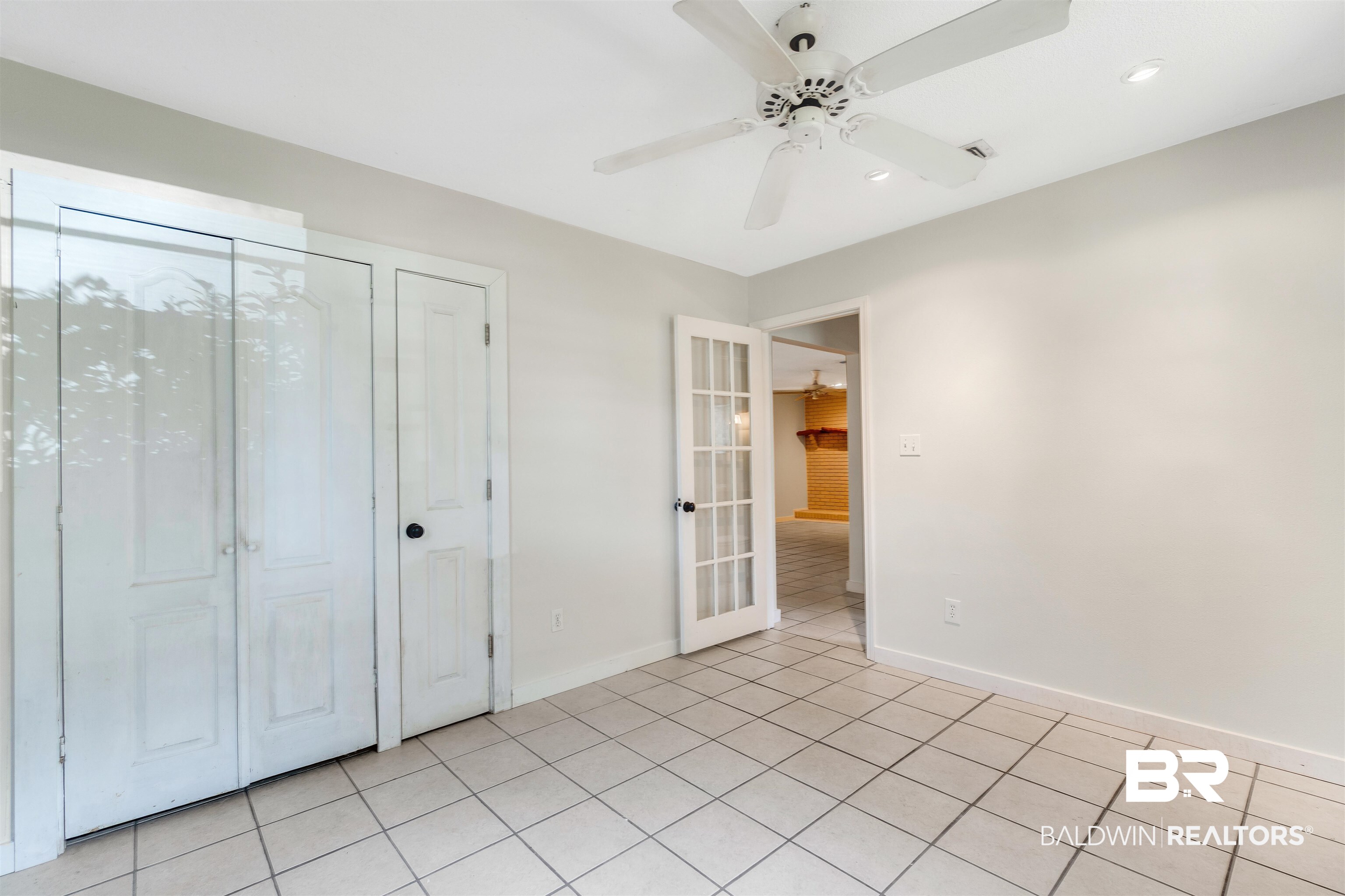 34341 Lost River Road Seminole, AL 36574 - Photo 16 of 36 Unfurnished bedroom featuring light tile patterned floors, recessed lighting, and ceiling fan