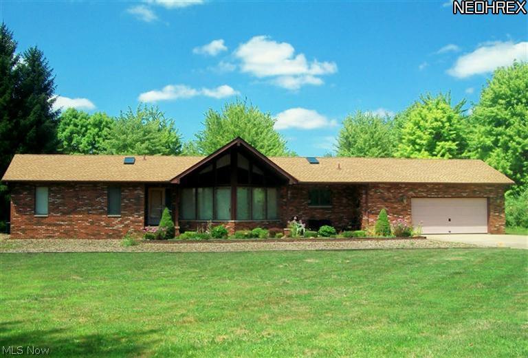 This sprawling ranch has plenty of windows and some skylights to let the sunshine in. The "shake look" roof is only a few years old.