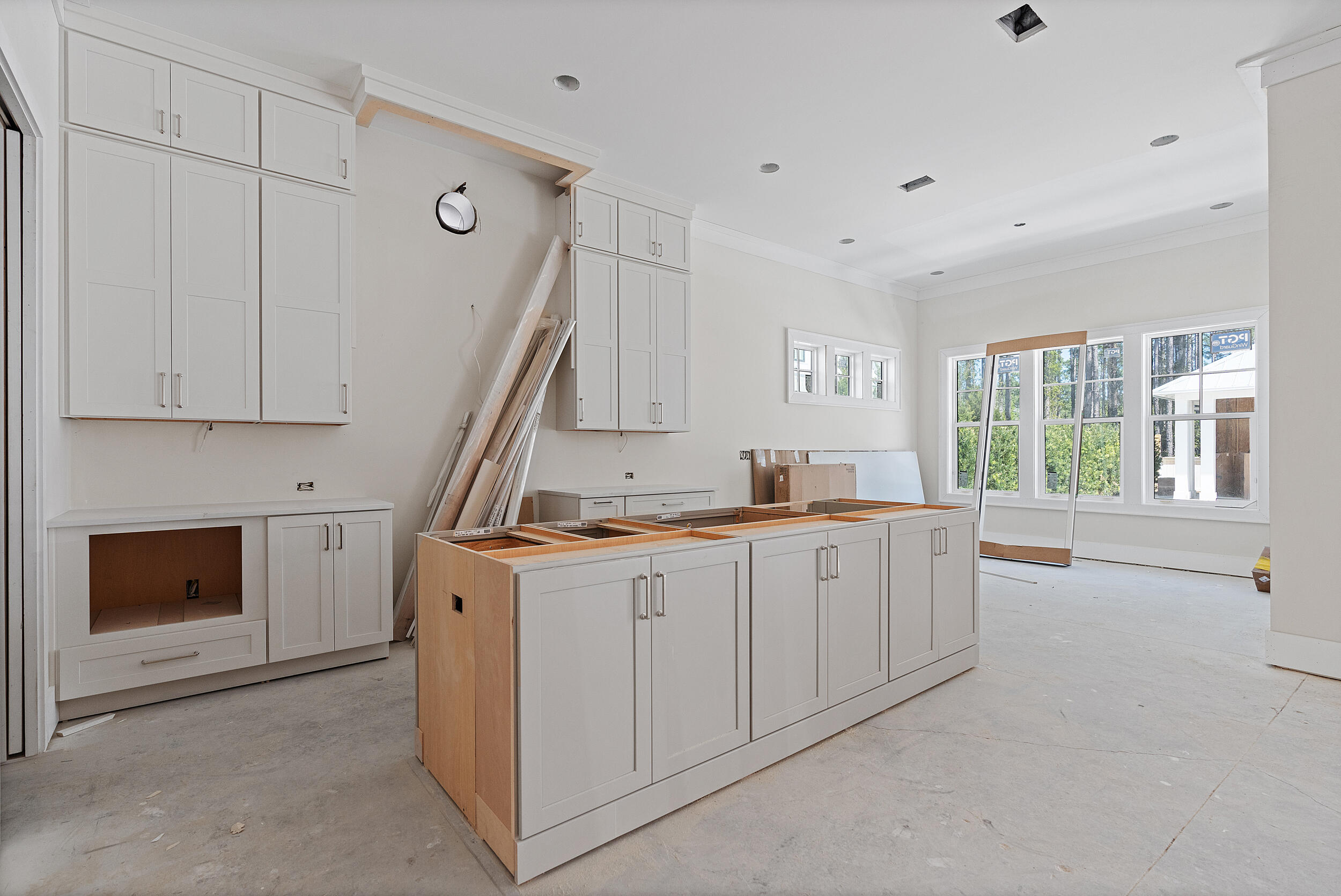 333 Pollard Cove, Unit LOT 96 Watersound, FL 32461 - Photo 3 of 37 a large white kitchen with granite countertop a sink