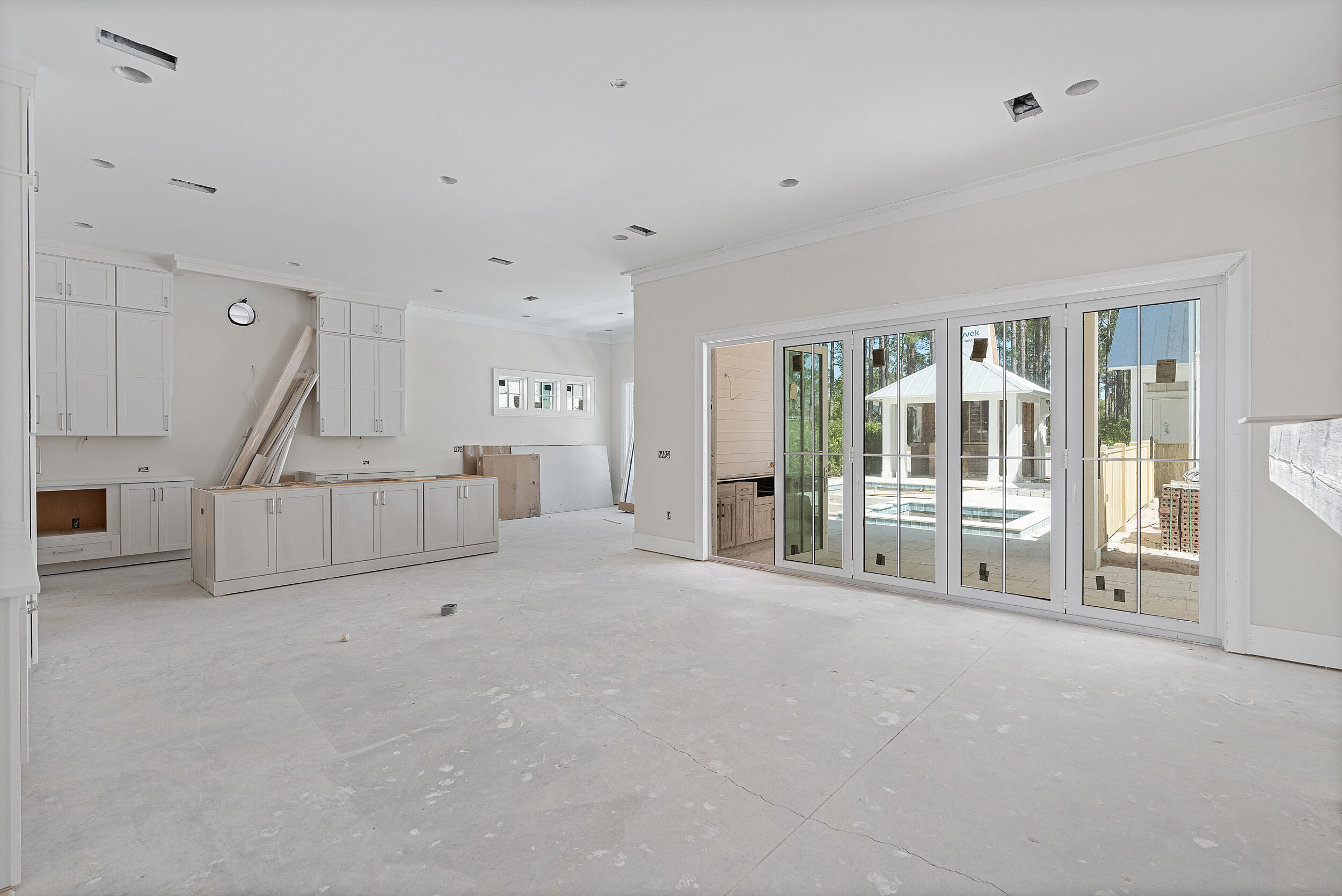 333 Pollard Cove, Unit LOT 96 Watersound, FL 32461 - Photo 5 of 37 a view of an empty room with a fireplace and a window