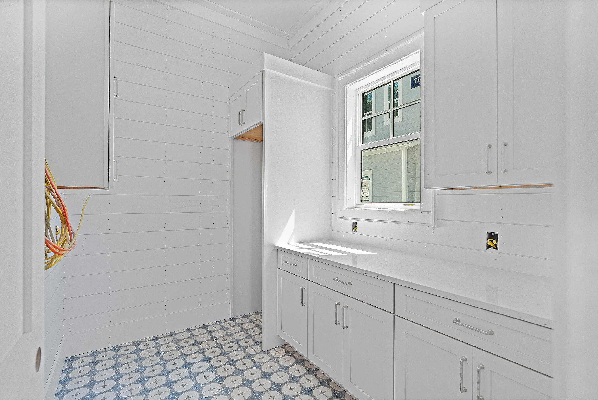 333 Pollard Cove, Unit LOT 96 Watersound, FL 32461 - Photo 7 of 37 a kitchen with a sink and cabinets