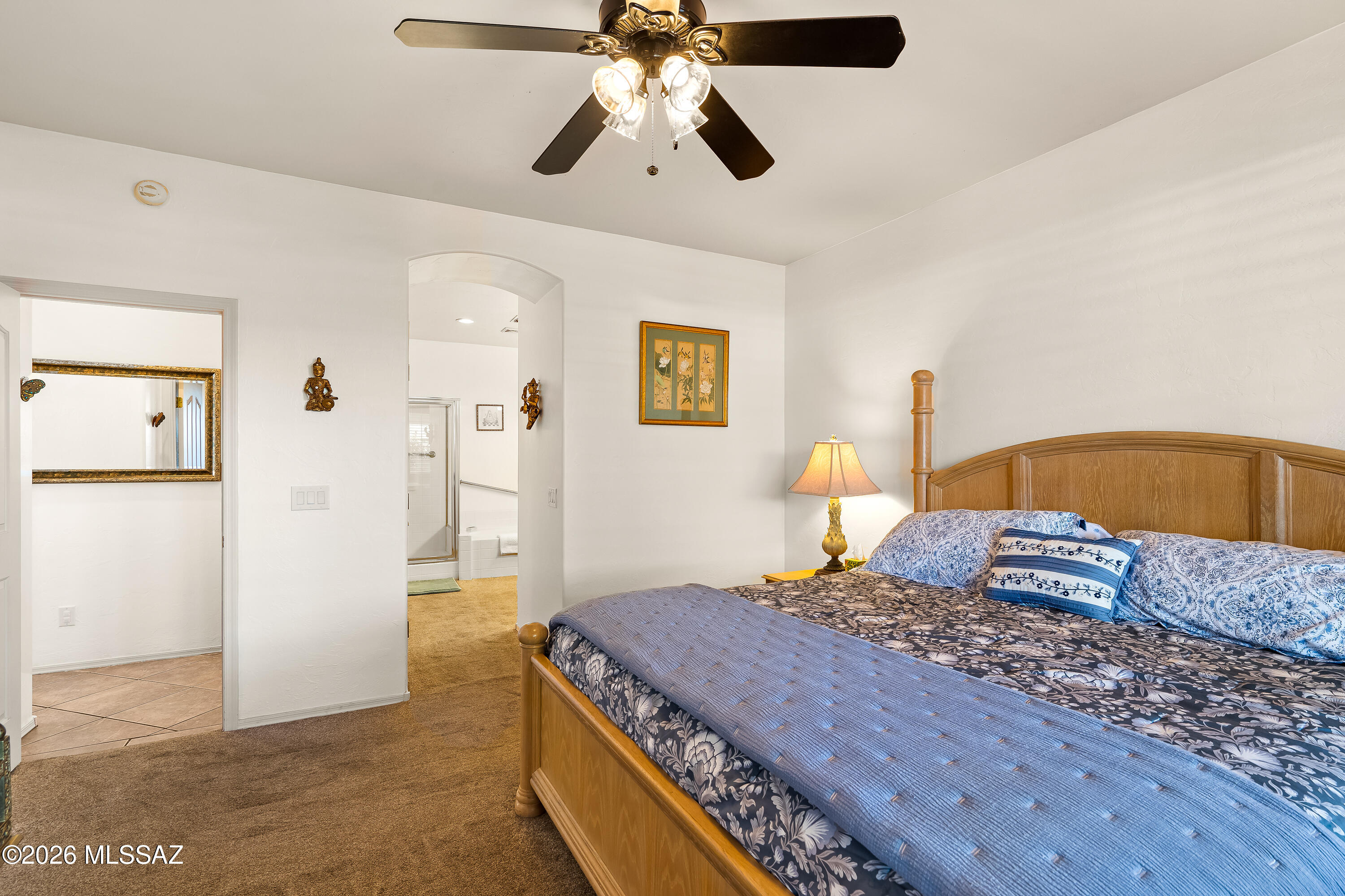 3396 North Camino Rio Colorado Tucson, AZ 85712 - Photo 15 of 32 a bedroom with a bed and wooden floor