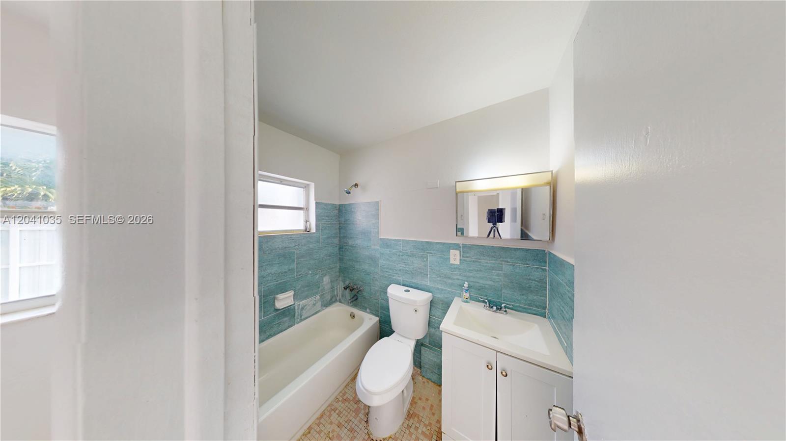 6811 Southwest 16th Street Miami, FL 33144 - Photo 7 of 21 a bathroom with a sink toilet and shower