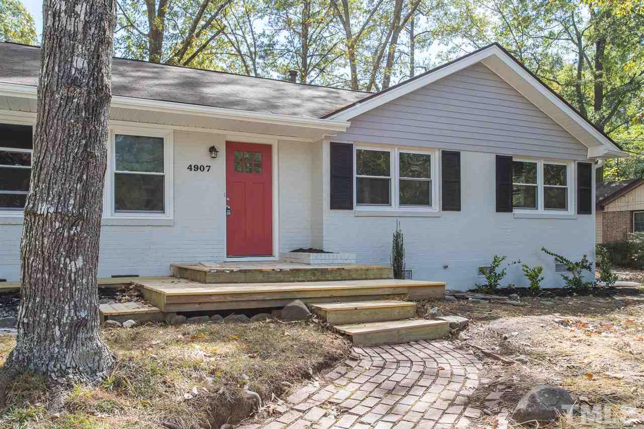 4907 Brentwood Road Durham, NC 27713 - Photo 1 of 27 a view of a house with a yard and sitting area