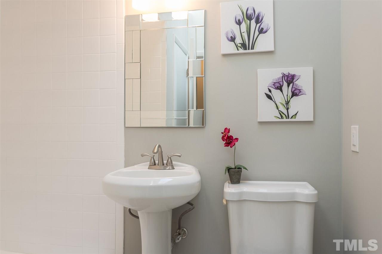 4907 Brentwood Road Durham, NC 27713 - Photo 17 of 27 a bathroom with a sink and a toilet