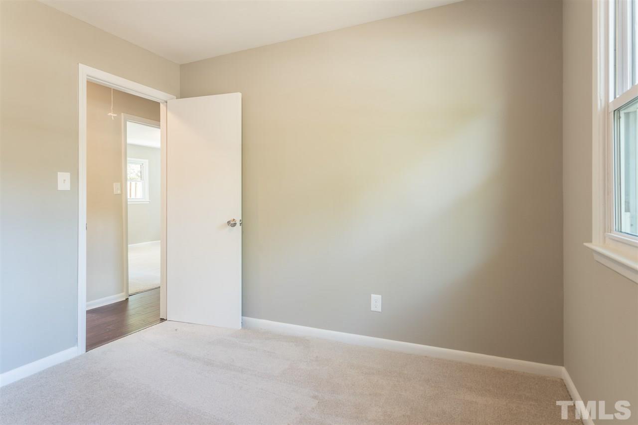4907 Brentwood Road Durham, NC 27713 - Photo 19 of 27 an empty room with windows