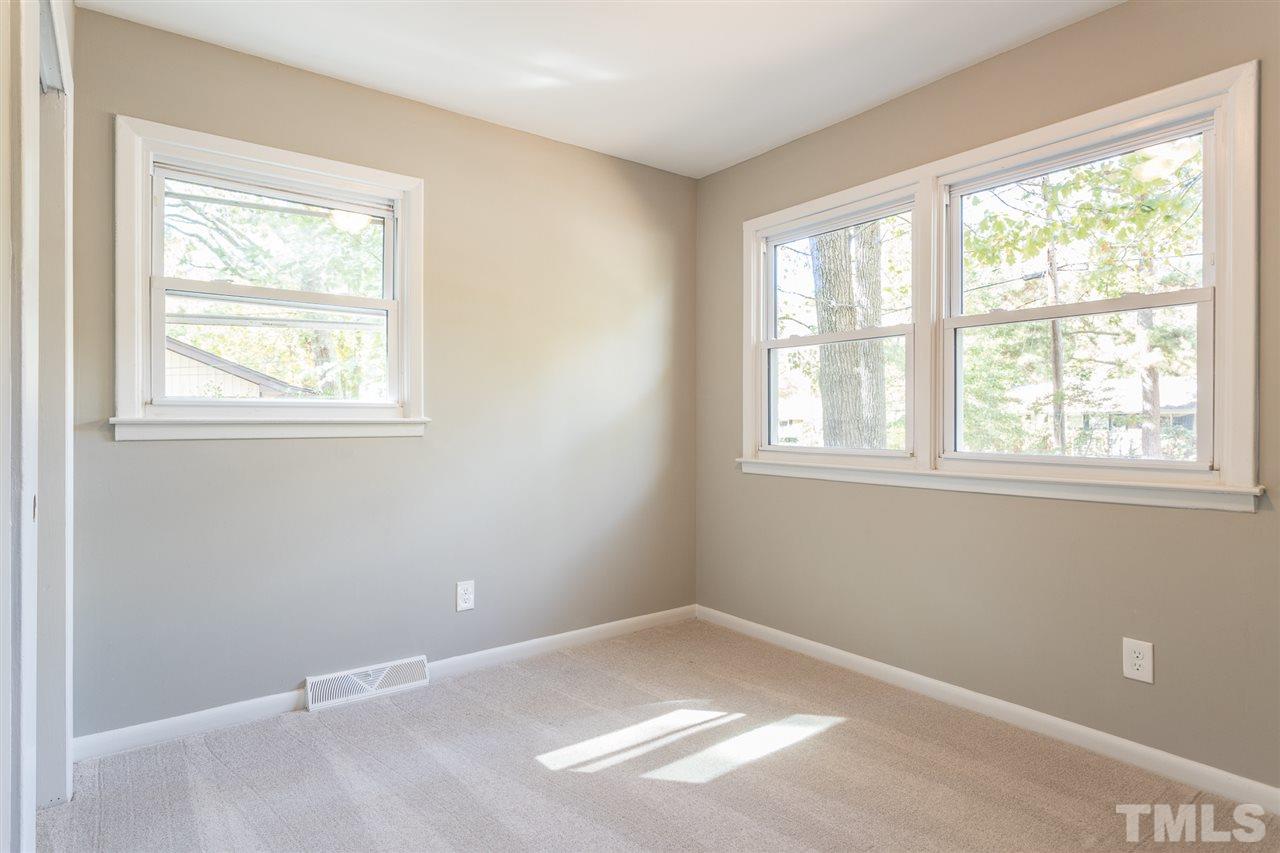 4907 Brentwood Road Durham, NC 27713 - Photo 20 of 27 an empty room with a window