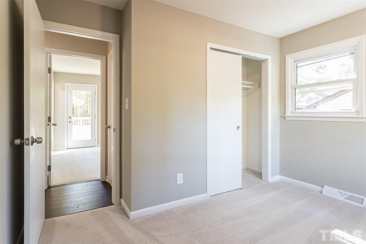 4907 Brentwood Road Durham, NC 27713 - Photo 22 of 27 an empty room with windows and closet