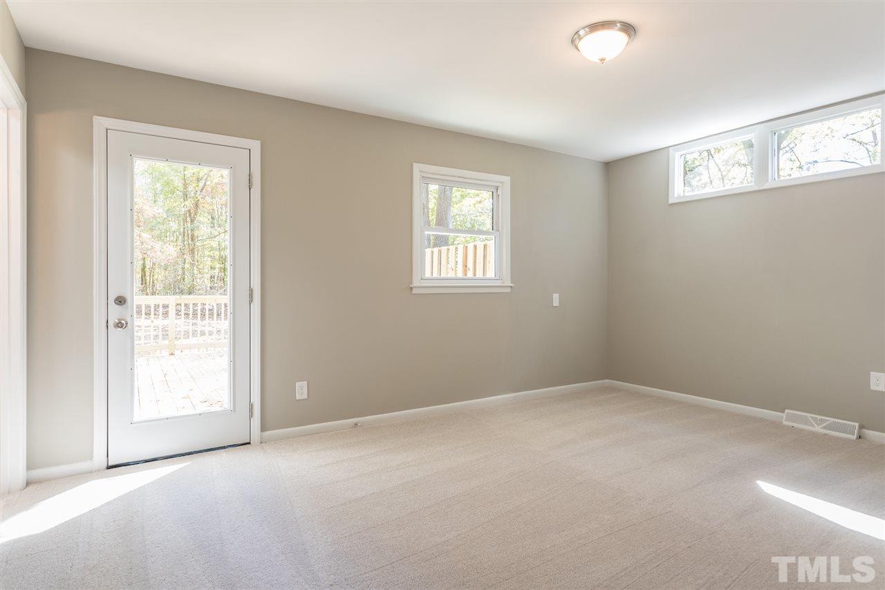 4907 Brentwood Road Durham, NC 27713 - Photo 23 of 27 an empty room with windows